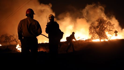 Firefighters begin a back burn against the Camp Fire on Pentz Road south Paradise, Calif., November 8, 2018. 