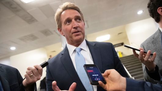 Sen. Jeff Flake, R-Ariz., speaks with reporters before he and Sen. Chris Coons, D-Del., try to bring up the legislation to protect special counsel Robert Mueller, at the Capitol in Washington, Wednesday, Nov. 14, 2018. 