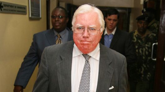 Jerome Corsi, who wrote "The Obama Nation: Leftist Politics and the Cult of Personality, walks down a corridor Tuesday, Oct. 7, 2008 as he arrives at the immigration department in Nairobi, Kenya. 