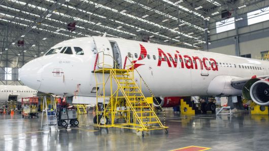 An airplane sits at the Avianca Holdings SA Maintenance, Repair and Overhaul (MRO) Aeronautical Center in Rionegro, Colombia on Tuesday, Nov. 7, 2017. Avianca Holdings SA reported a net income of $36.1 million USD in the third quarter despite a pilot strike that lasted for almost two months. 