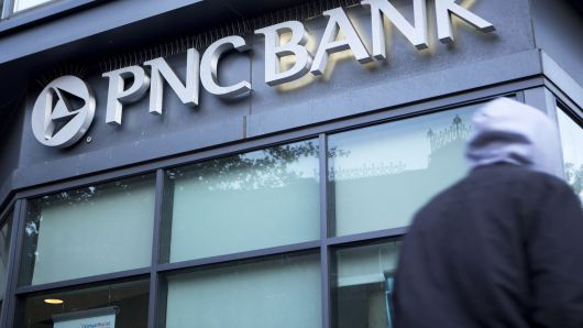 A pedestrian walks past a PNC Bank branch in Washington, D.C.