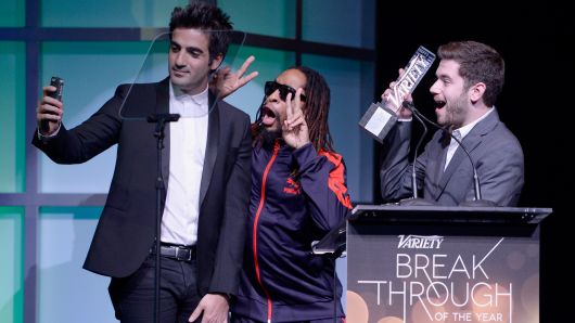 Honorees Rus Yusupov (L) and Colin Kroll (R) accept the Breakthrough Award for Emerging Technology from rapper Lil Jon (C) onstage at the Variety Breakthrough of the Year Awards during the 2014 International CES at The Las Vegas Hotel & Casino on January 9, 2014 in Las Vegas, Nevada.