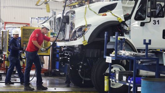 Employees work at the assembly line of International brand commercial trucks, owned by Navistar, at the manufacturing plant in Escobedo, on the outskirts of Monterrey, Mexico, June 29, 2017.