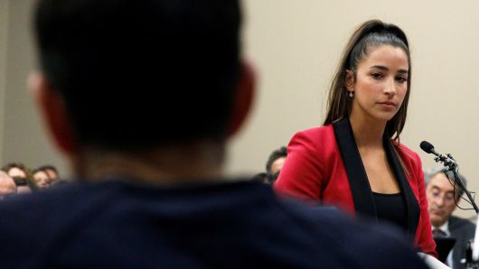 Victim and Olympic gold medalist Aly Raisman speaks at the sentencing hearing for Larry Nassar, (R) a former team USA Gymnastics doctor who pleaded guilty in November 2017 to sexual assault charges, in Lansing, Michigan, January 19, 2018.