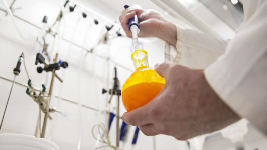 A scientist mixes chemicals inside the lab at the GlaxoSmithKline Plc facility in Collegeville, Pennsylvania.