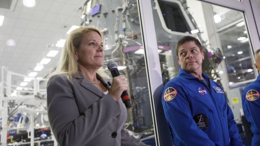 Gwynne Shotwell president and chief operating officer of SpaceX, left, speaks as NASA astronaut Bob Behnken looks on.
