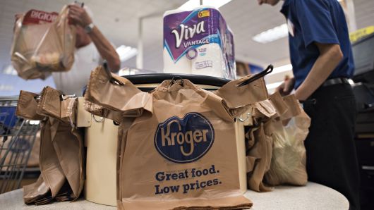 An employee bags a customer's purchases at a Kroger Co. store in Peoria, Illinois.