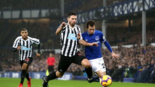 Fabian Schar of Newcastle United battles for possession with Bernard of Everton during a Premier League match on December 5, 2018 in Liverpool, United Kingdom. 