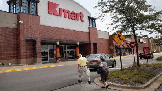 Shoppers walk toward a Kmart store in Elmhurst, Illinois. 