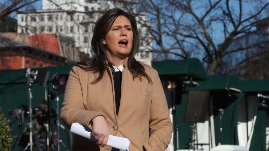 White House Press Secretary Sarah Huckabee Sanders speaks to the media in the White House driveway after appearing on a morning television show on December 18, 2018 in Washington, DC.
