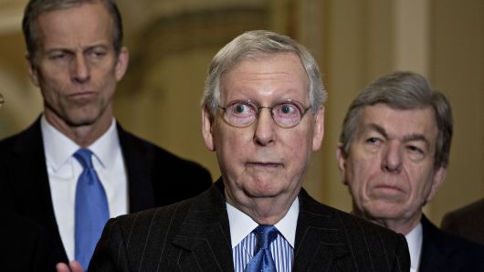 Senate Majority Leader Mitch McConnell, a Republican from Kentucky, center, speaks as Senator John Thune, a Republican from South Dakota, left, and Senator Roy Blunt, a Republican from Missouri, listen during a news conference after a GOP caucus meeting at the U.S. Capitol in Washington, D.C., U.S., on Tuesday, Dec. 11, 2018.