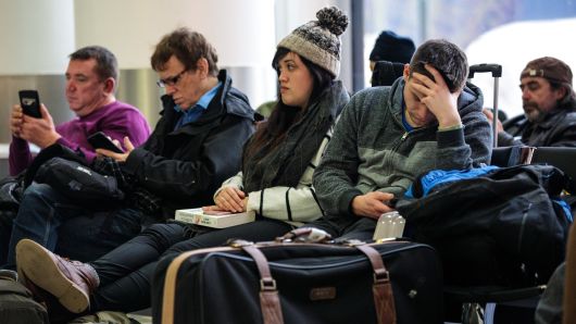 Passengers wait in the South Terminal building at London Gatwick Airport on December 21, 2018 in London, England.