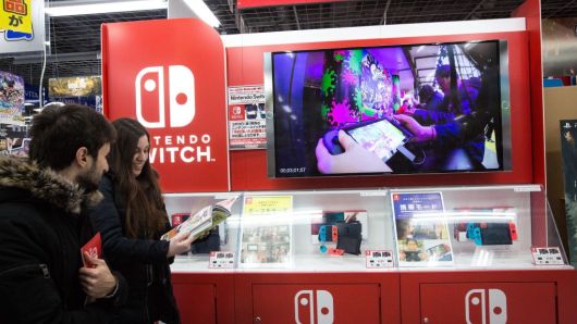 Japanese gamers buy the new video game Nintendo Switch games console by Nintendo Co. during the first day of sales worldwide in Tokyo, Japan on March 03, 2017.
