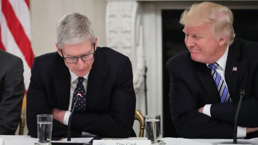 Apple CEO Tim Cook with U.S. President Donald Trump during a meeting of the American Technology Council on June 19, 2017.