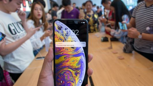 A customer shows his iPhone XS Max during the launch of iPhone XS and iPhone XS Max at  an Apple store on the Nanjing East Road on September 21, 2018 in Shanghai, China. 