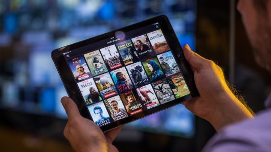 A selection of Netflix original content sits displayed in the Netflix app on an Apple iPad tablet device in this arranged photograph in London.