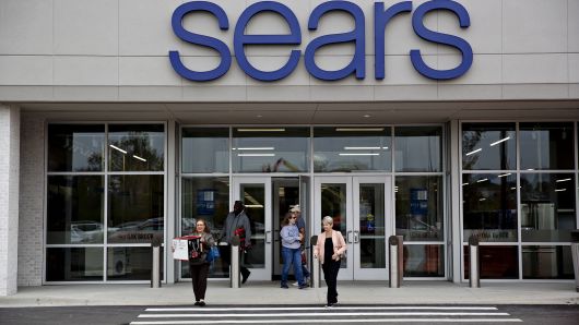 Shoppers exit a newly renovated Sears Holdings Corp. store in Oak Brook, Illinois.