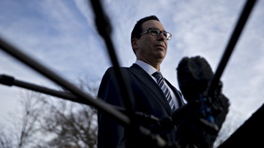 Steven Mnuchin, U.S. Treasury secretary, listens to a question while speaking to members of the media outside the White House in Washington, D.C., U.S., on Monday, Dec. 3, 2018. 
