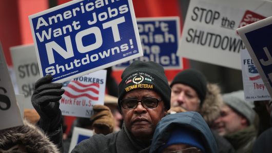 Government workers protest the government shutdown during a demonstration in the Federal Building Plaza on Jan. 10, 2019 in Chicago, Illinois.