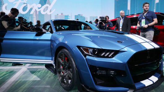 Members of the media look over the 2020 Ford Mustang Shelby GT500 after it was revealed at the North American International Auto Show in Detroit, Michigan, January 14, 2019.