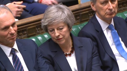 Prime Minister Theresa May listens in the House of Commons, London.