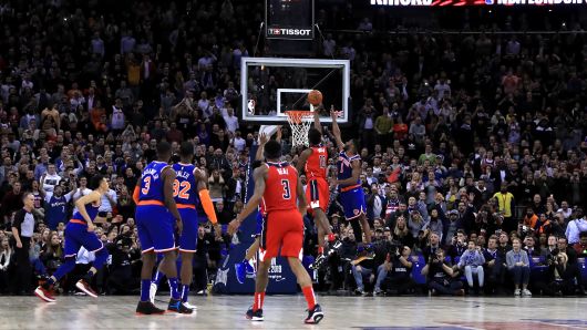 Washington Wizard's Thomas Bryant (second right) shoots only to be Goaltending fouled for the winning points during the NBA London Game 2019 at the O2 Arena, London.