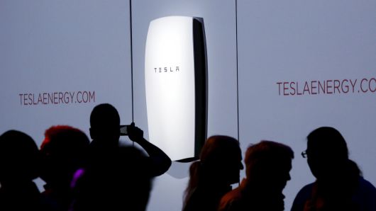 Attendees take pictures of the new Tesla Energy Powerwall Home Battery during an event at Tesla Motors in Hawthorne, California April 30, 2015.
