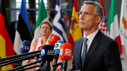 NATO Secretary-General Jens Stoltenberg talks to the media as he arrives at an European Union leaders summit in Brussels, Belgium, June 28, 2018.