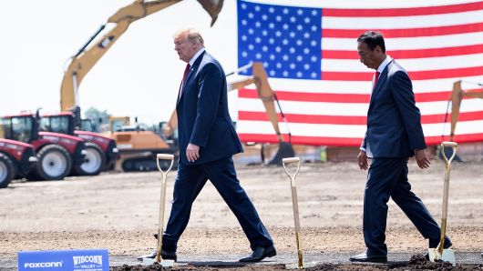President Donald Trump (L) and Terry Gou, chairman of Apple iPhone manufacturer Foxconn, at a groundbreaking for Foxconn's new LCD screen facility on June 28, 2018 in Mount Pleasant, Wisconsin. 