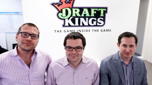 From left, the three co-founders of DraftKings, Matt Kalish, Paul Liberman and Jason Robins, pose together in their Boston office on Apr. 24, 2017.