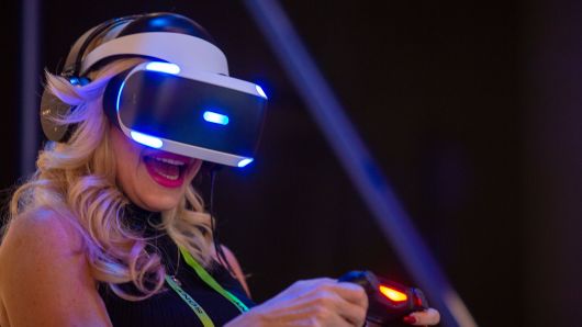 A woman plays ASTRO BOT Rescue Mission at a Playstation VR display at the Sony Exhibit at the Las Vegas Convention Center during CES 2019 in Las Vegas on January 9, 2019.