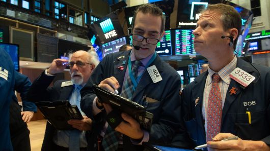 Traders work on the floor at the closing bell of the Dow Industrial Average at the New York Stock Exchange on January 10, 2019 in New York.