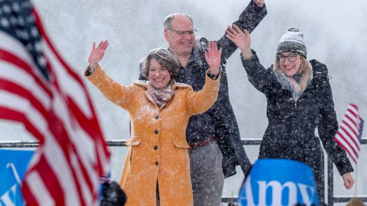 Senator Amy Klobuchar waves to the crowd with her husband John Bessler and daughter Abigail Bessler after announcing her candidacy for the 2020 Democratic presidential nomination in Minneapolis, Minnesota, February 10, 2019.