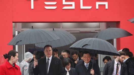 Tesla boss Elon Musk (L) walks with Shanghai Mayor Ying Yong during the ground-breaking ceremony for a Tesla factory in Shanghai on January 7, 2019. - Musk presided over the ground-breaking for a Shanghai factory that will allow the electric-car manufacturer to dodge the China-US tariff crossfire and sell directly to the world's biggest market for 'green' vehicles. (Photo by STR / AFP) / China OUT (Photo credit should read STR/AFP/Getty Images)