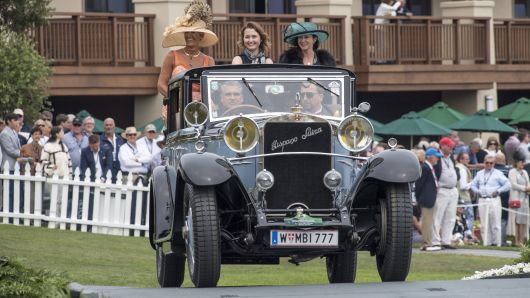 Exhibitors ride in a 1922 Hispano Suiza H6B Chapron Splendid Landaulet motor vehicle during the 2016 Pebble Beach Concours d'Elegance in Pebble Beach, California, on Sunday, Aug. 21, 2016.