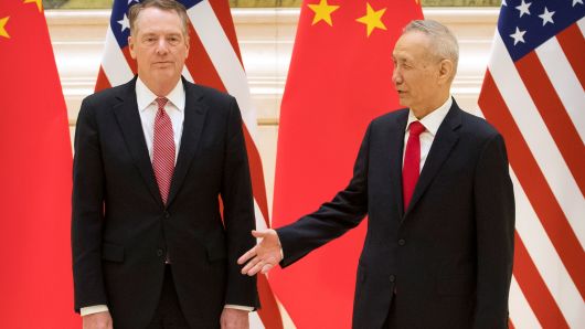 Chinese Vice Premier and lead trade negotiator Liu He, right, reaches to shake hands with U.S. Trade Representative Robert Lighthizer before the opening session of trade negotiations at the Diaoyutai State Guesthouse in Beijing, Thursday, Feb. 14, 2019.