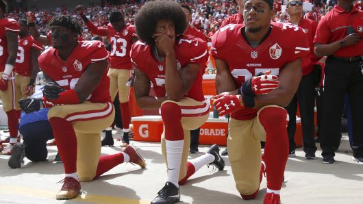 From left, San Francisco 49ers Eli Harold (58), quarterback Colin Kaepernick (7) and Eric Reid (35) kneel during the national anthem before their NFL game against the Dallas Cowboys on Sunday, Oct. 2, 2016 at Levi's Stadium in Santa Clara, Calif.