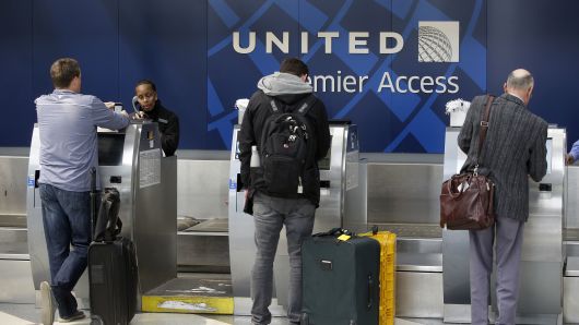 Travelers check-in at the United Airlines Premier Access at O'Hare International Airport on April 12, 2017 in Chicago, Illinois.