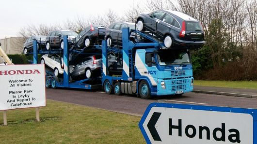 A transporter loaded with Honda cars leaves the Honda car factory in Swindon, southwest England, on January 30, 2009. Workers at Honda's British factory made the last cars Friday before a four-month shutdown caused by a sharp fall in worldwide sales. Production at the Japanese giant's plant in Swindon, southwest England, will be halted until June 1, with 4,200 workers receiving full pay for the first two months, reduced to 60 percent for the rest of the shutdown. AFP PHOTO/Max Nash (Photo credit should read MAX NASH/AFP/Getty Images)