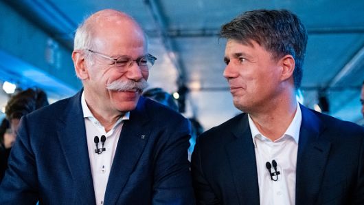 22 February 2019, Berlin: Harald Krüger (r), Chairman of the Board of Management of BMW AG, and Dieter Zetsche, Chairman of the Board of Management of Daimler AG and Head of Mercedes-Benz Cars, sit together at the beginning of a press conference on the launch of the joint mobility company of BMW and Daimler.