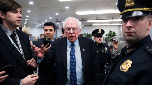 Sen. Bernie Sanders, I-Vt., talks with reporters in the Capitol on Thursday, February 14, 2019.