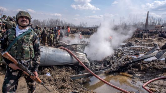 Indian government and military forces attend to the scene of a crashed Indian Air Force aircraft on February 27, 2019 in Budgam west of Srinagar, the summer capital of Indian administered Kashmir, India.