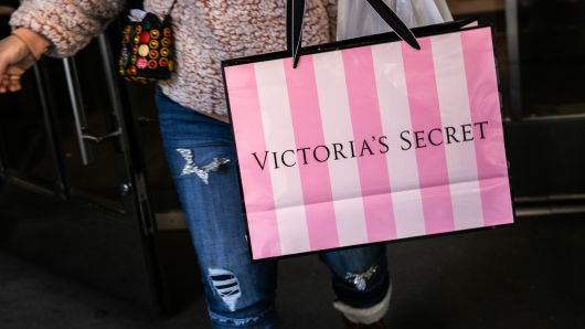 A customer carries a shopping bag while exiting a Victoria's Secret Stores LLC store, a subsidiary of L Brands Inc., in New York, U.S., on Wednesday, Nov. 14, 2018. Victoria's Secret has been under scrutiny for failing to keep up with shifting consumer demands, especially involving themes of female empowerment and diversity. Photographer: Jeenah Moon/Bloomberg via Getty Images
