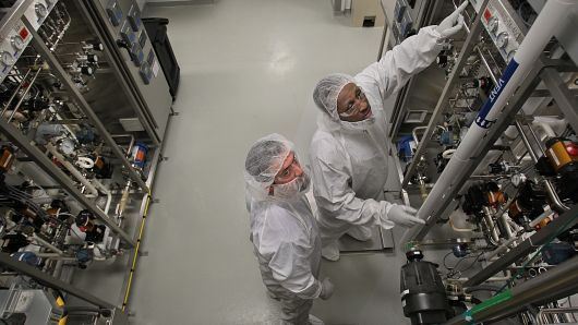 File photo: Michael LeClair, left, and Kevin Fleurimond, in the manufacturing room of Biogen Idec.