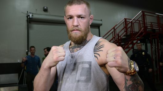 UFC featherweight champion Conor McGregor poses after a news conference with lightweight contender Nate Diaz at UFC Gym February 24, 2016, in Torrance, California.