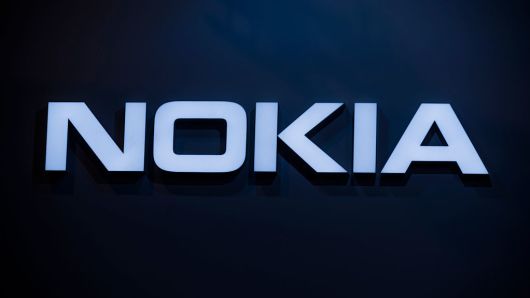 An 'Nokia' logo sits illuminated outside the Nokia pavilion at the annual Mobile World Congress, one of the most important events for mobile technologies and a launching pad for smartphones, future technologies, devices, and peripherals.