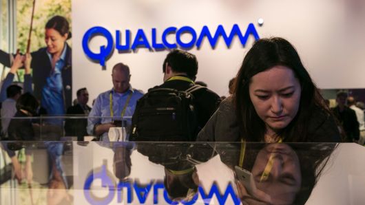 People crowd into the Qualcomm booth to view a series of new products during the annual Consumer Electronics Show on Jan. 4, 2017 in Las Vegas.