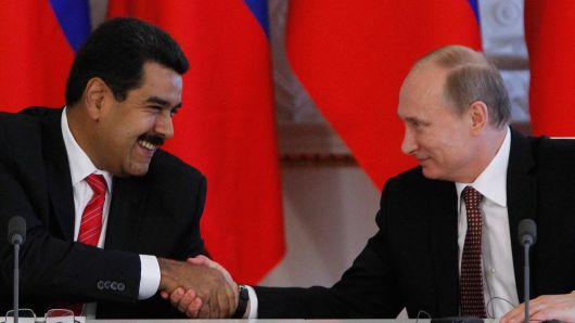 Russia's President Vladimir Putin and his Venezuelan counterpart Nicolas Maduro shake hands during a ceremony at the Kremlin in Moscow, on July 2, 2013.