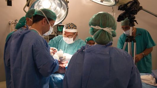 Doctors perform a face-lift in Rio de Janeiro, Brazil.