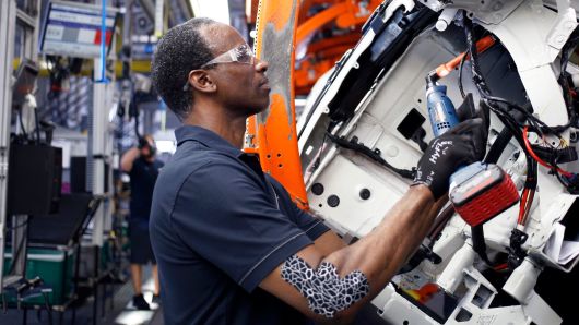 A worker assembles a vehicle at the BMW plant in Greer, South Carolina.